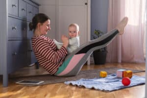 mother with baby make yoga at home to be strong an 2022 11 23 23 02 04 utc