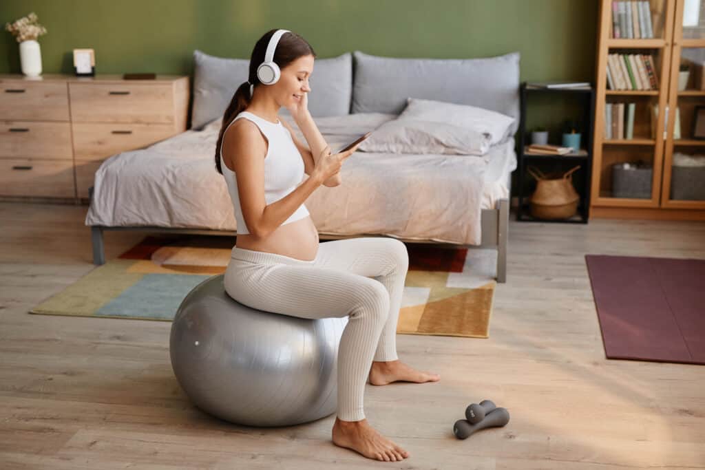 Pregnancy and Pilates: A Love Story 2 pregnant woman exercising on fitness ball 2022 02 02 18 48 55 utc