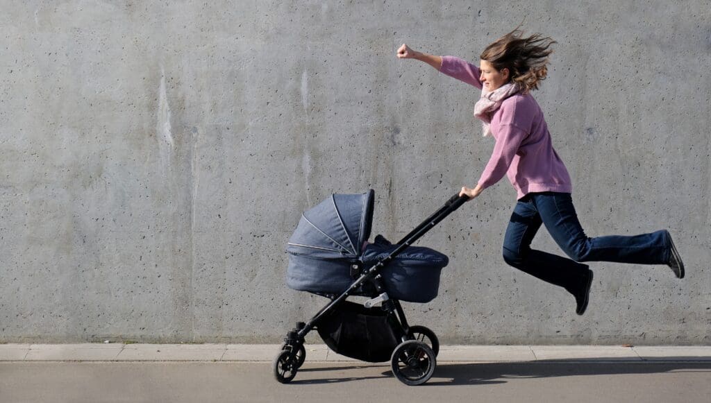 Pilates for Busy Moms: How Short Classes Can Make a Big Impact 2 super heroine mother flying with newborn stroller 2022 11 01 06 18 22 utc