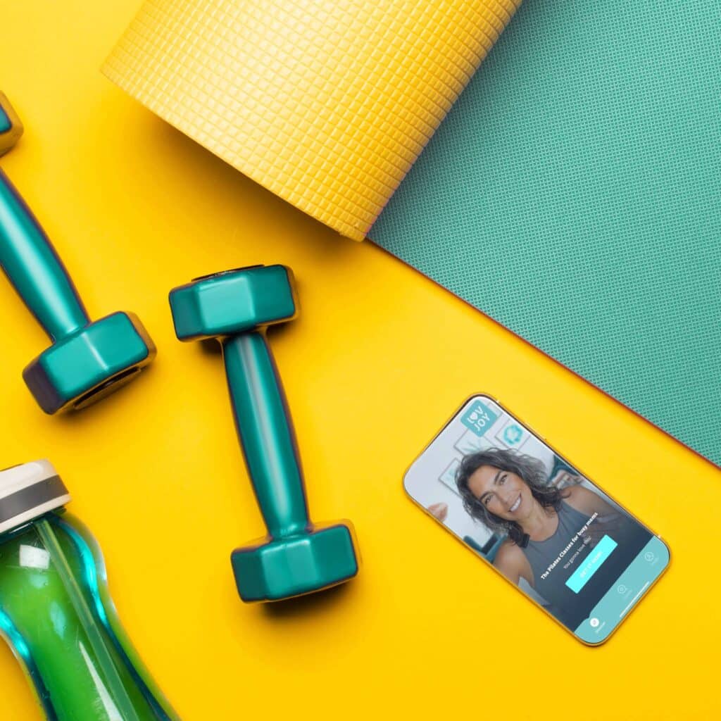 Ready to kick menopause's butt? 3 top view of blue fitness mat with dumbbells smart